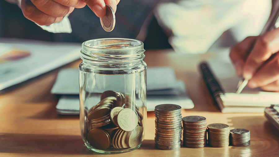 putting coins in jar